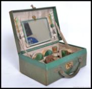 An early to mid 20th century 1930's enamel plated vanity set,