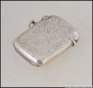 A silver hallmarked vesta case with rococo chase decoration by William Hair Haseler,
