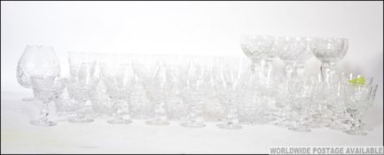 An extensive collection of cut lead crystal glass wares to include wine glasses, goblets,
