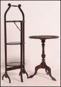 An Edwardian oak 3 tier metamorphic cake stand with circular tiers together with a mahogany Regency