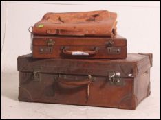 A stunning Swaine Adeney Brigg leather suitcase along with another also with a leather gents