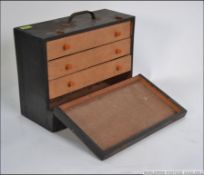 An antique / mid century watchmakers / engineers tool cabinet.