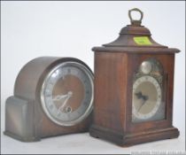 Two 20th century mantle clocks to include a Tempus Fugit oak cased bracket clock having a brass