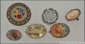 A collection of ladies silver brooches to include cameo set,