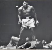 A personally signed black and white photograph of Mohammed Ali being limited edition 32 / 50.