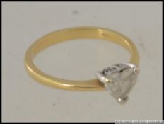 An 18ct gold and diamond single stone heart shaped ring.