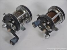 2 vintage sea fishing reels ' ABU Ambassadeur 6000C ' in black both with reel and Swedish crests.
