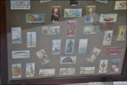 CIGARETTE CARDS: A 1940's oak framed fire side screen,