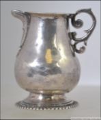 A small 18th century Spanish silver cream jug by Juan Ignacio Montero of Salamanca 1759 - 1781 )