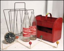 A collection of retro items to include atomic coat rack, tin dolly, retro Coca Cola bottles etc.