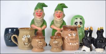 A collection of ceramics to include a pair of gnomes, Orville money box,