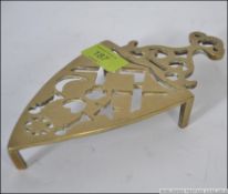 A pierced Victorian brass trivet pierced with masonic symbols
