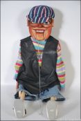 A amateur scratch built ventriloquist dummy having moving mouth, rosy cheeks,