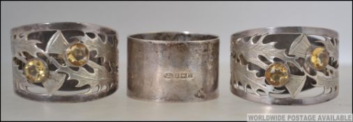 2 silver hallmarked Scottish napkin rings being lattice worked into thistles,