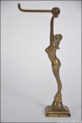 A 1930's Art Deco brass pocket watch stand holder in the form of a maiden with hook atop,