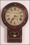 A late 19th Century oak cased eight day drop dial station wall clock by John Bennet 64-65