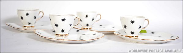 A 1950's Royal Vale 4 piece tennis set having white glaze with black star decoration.
