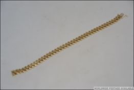 A ladies 9ct gold / 375 marked bracelet of Omega linked form having clasp. Measures 19.5cms long.