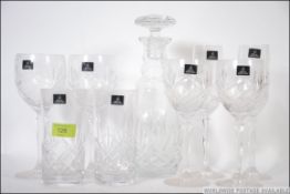 A Royal Doulton cut glass crystal decanter set to include the decanter with stopper and glasses
