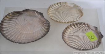 A set of 3 sterling silver oyster dishes by Birks, 1 large and 2 smaller examples.