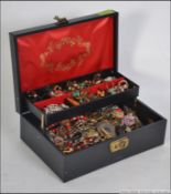 Mixed jewellery filled casket to include white metal , plastic , glass ,