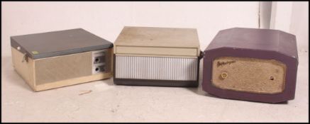 A collection of 2 vintage portable record players to include Portodyno,