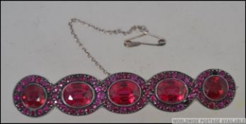 A Victorian silver and tourmaline bar brooch.