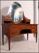 A quality Edwardian mahogany inlaid Waring & Gillows dressing table chest being raised on square