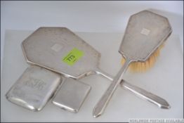 A silver hallmarked cigarette case by Adie Bros bearing Birmingham hallmarks for 1926, weight 50.