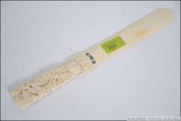 A 19th century Dieppe style Ivory page turner.