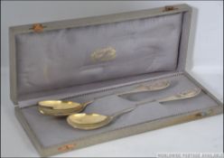 A cased silver 800 marked pair of salad servers by Wilkens & Soehne, Bremen,