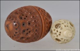 A 19th century Chinese ivory puzzle ball with decorative inner ball being finely carved together