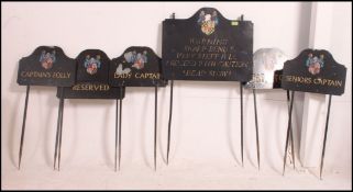 A collection of retro 20th century metal Castle Combe golf club parking signs,