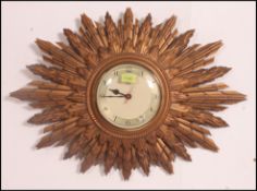 A 1930's Art Deco Smith sunburst wall clock.