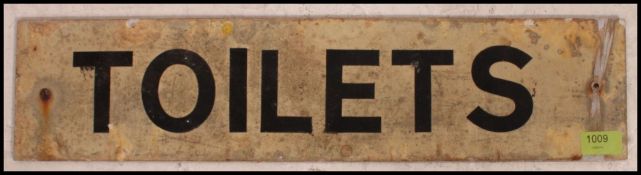 A vintage 1950's metal Industrial painted sign ' Toilets ' of rectangular form.