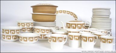 A retro 20th century Susie Cooper part dinner / tea service in a decorative design having cups,