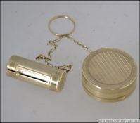 A vintage Houbigant of France Art Deco gilt metal Powder Compact and telescopic lipstick holder
