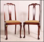 2 good quality Edwardian Queen Anne dining chairs raised on cabriole legs with pad feet having drop