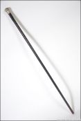A silver hallmarked knop topped promenade cane with ebonised tapering shaft.