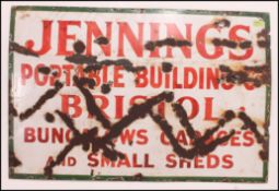 Local Interest - A vintage early 20th century enamel advertising sign having a green border with