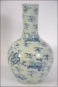 A large oversized Chinese blue and white bottle necked vase, having dragon and cloud decoration.