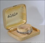 1960's silver ladies watch , imported and hallmarked to verso , fine marcasite decoration .