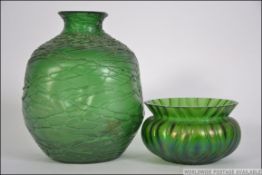 A decorative green art glass with drip overlay in the manner of Loetz together with another