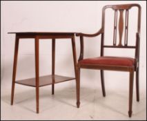 An Edwardian mahogany inlaid drop leaf sutherland table together with a similar Edwardian mahogany