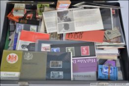 A good collection of presentation packs dating from the 1960's along with several books of unused