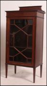 An Edwardian solid mahogany inlaid display cabinet.