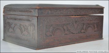 A late 19th century Chinese carved wooden work / jewellery box having decorative carved panels to