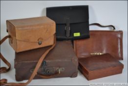 A collection leather cases and hand bags to include a gentlemans valet case with contents
