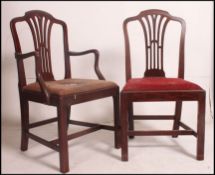 A set of 8 19th century Georgian mahogany dining chairs raised on squared supports united by