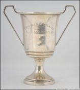 A silver hallmarked twin handled trophy bearing the inscription ' CONCOURS D'ELEGANCE FIAT 500 /